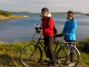 Beth and a friend riding the coast of Ireland