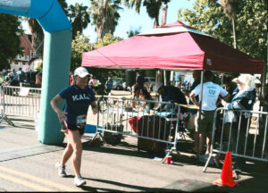 Mone Cassier finishing the Maui Half Marathon to raise seed money for Sober Sisters Recovery.